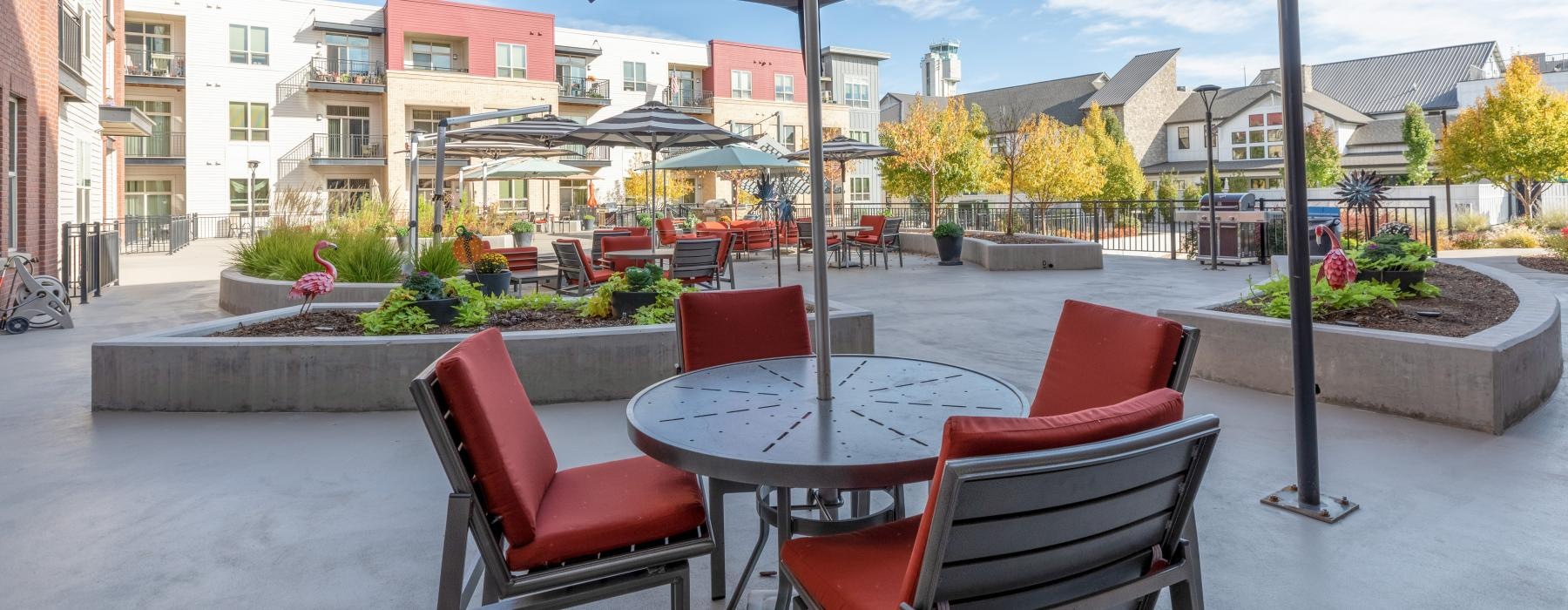 poolside patio with tables and chairs