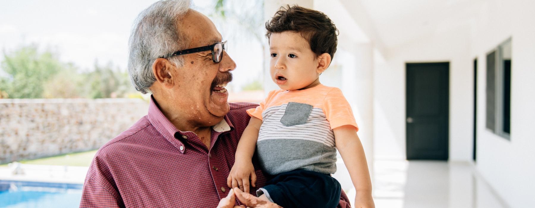 Grandpa and his grandchild smiling 