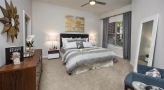 Spacious bedroom with carpeted floors