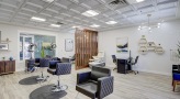 salon area with chairs and a window