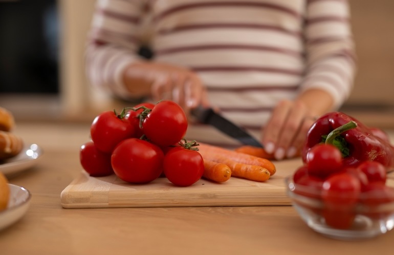 a hand cutting vergtables