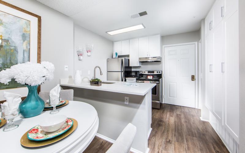 a kitchen with white cabinets