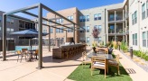 outdoor grilling area with dining tables