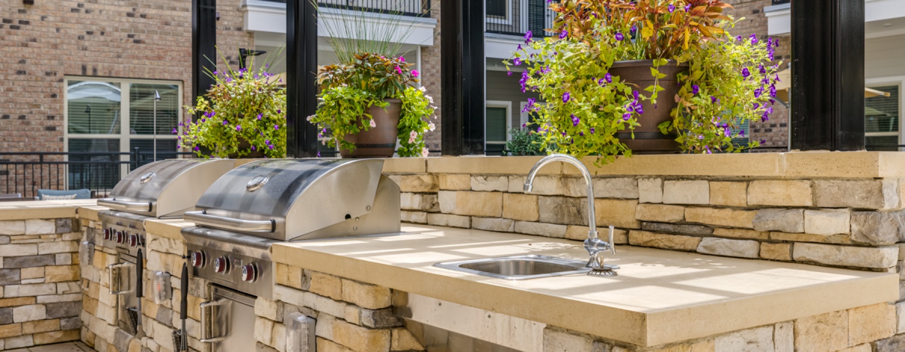 Sunny grilling areas with sinks and plants