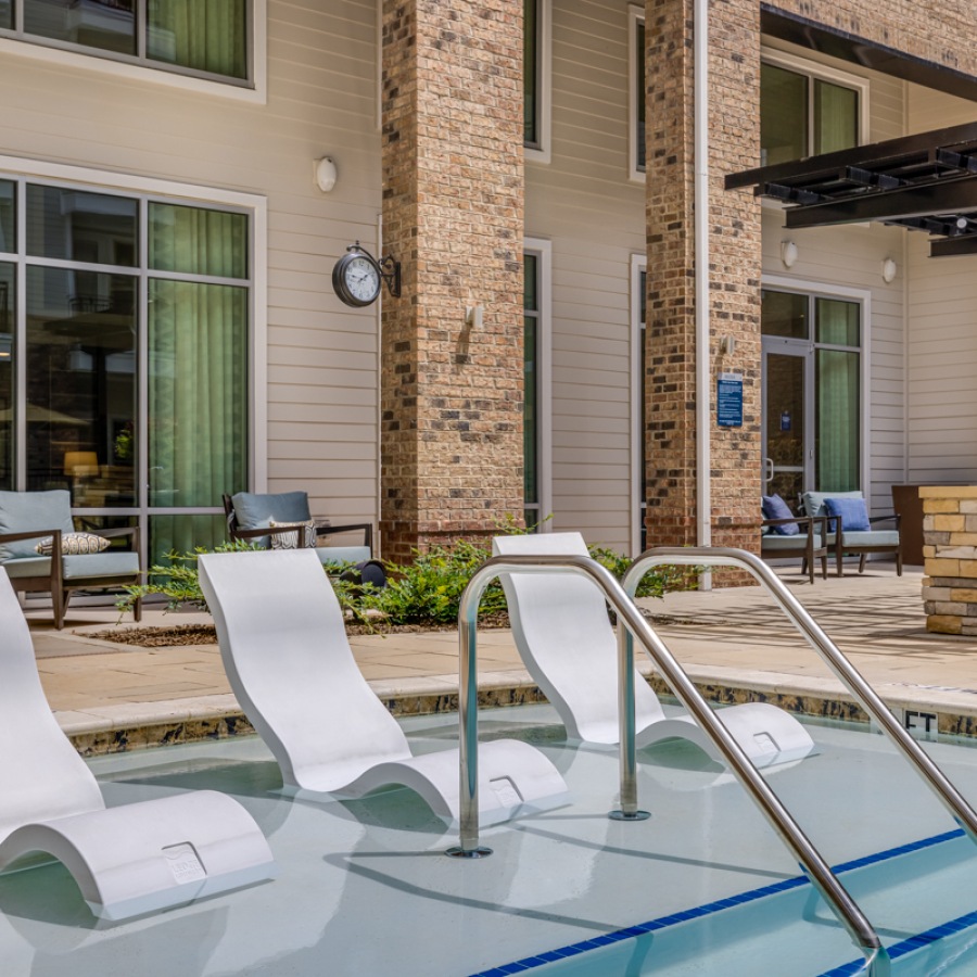 Swimming Pool Lounge chairs in a beautiful pool