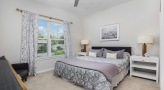 Large bedroom with carpeted floors 