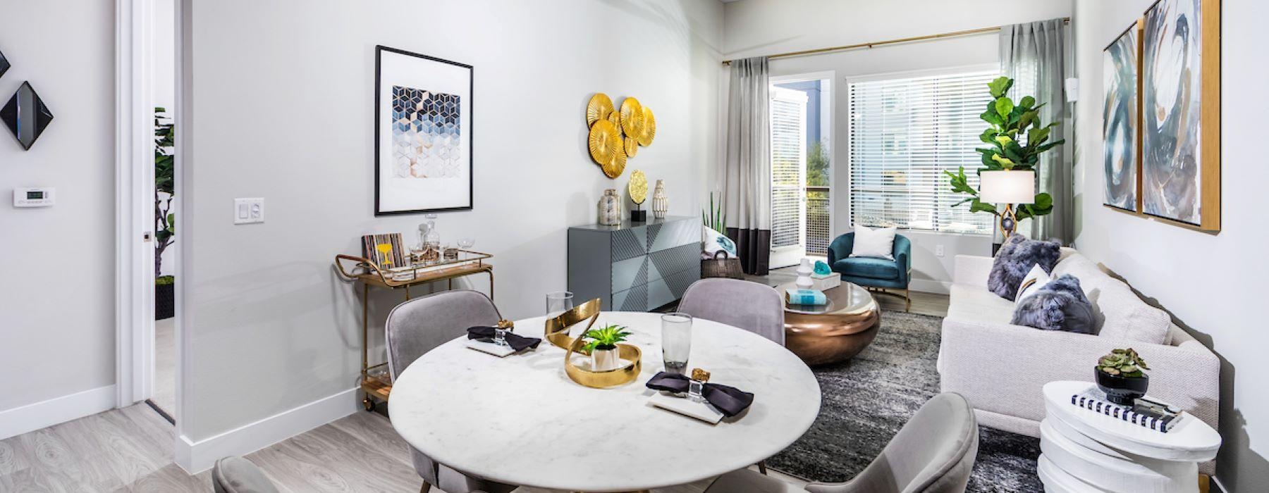 a living room with a large table and chairs