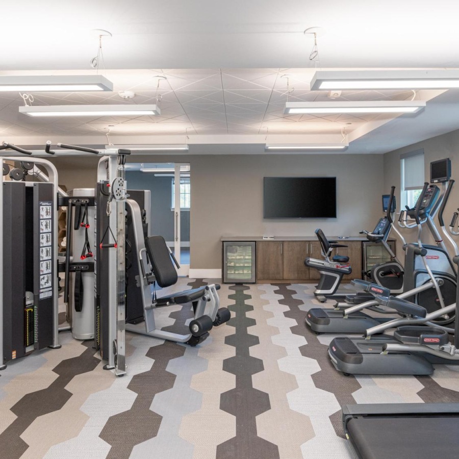 Fitness Center Large fitness center with ample machines and wood floors