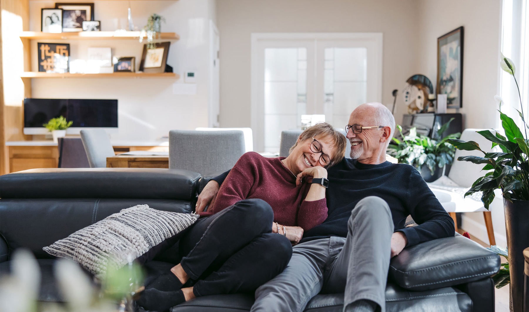 a man and woman sitting together on a couch