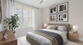 bedroom with a bed and pictures on the wall