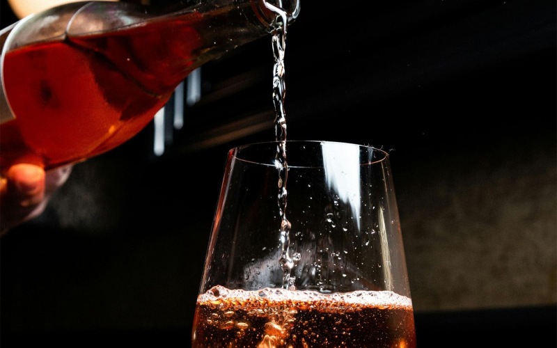 a glass of wine being poured