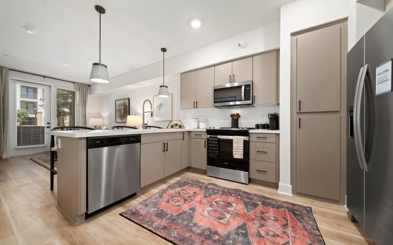 a kitchen with a rug