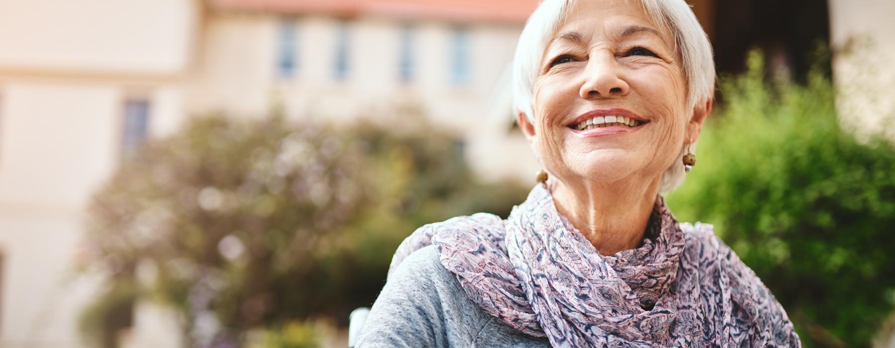 woman waling outside and smiling 