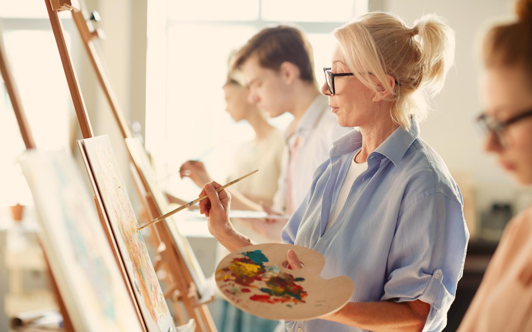 It’s Time to Rethink Your Best Life a group of people painting