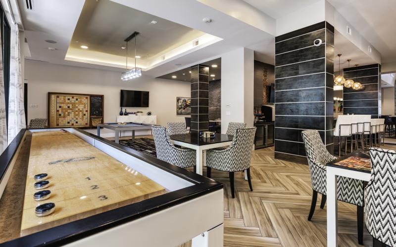 game room with shuffleboard table