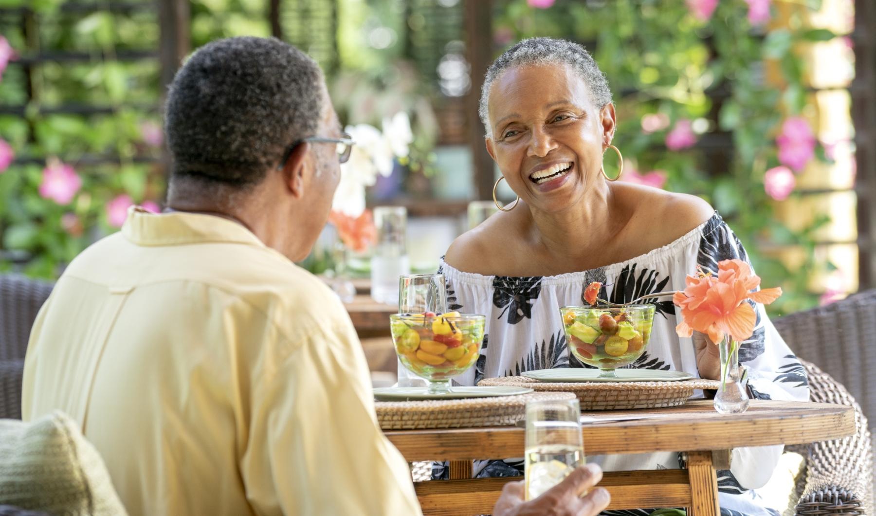 Your Joy to Embrace a man and woman sitting at a table with bowls of fruit