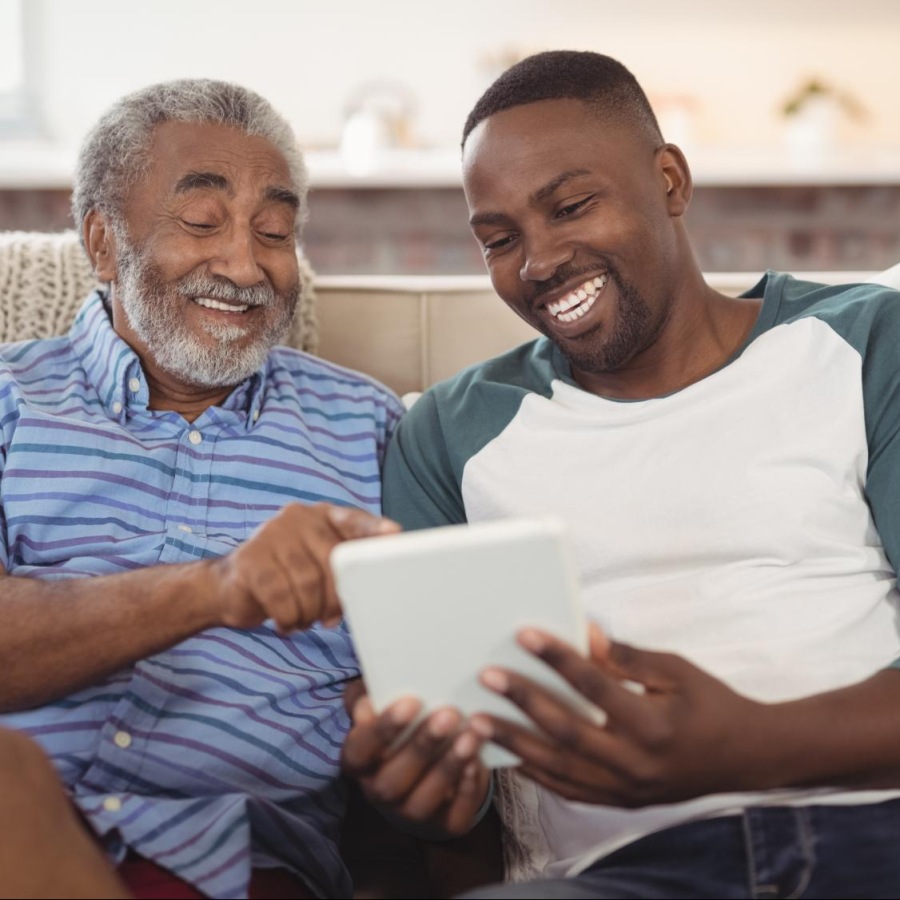 Find your perfect fit at Destinations Alexander two men sitting on a couch looking at a tablet