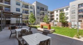 Large outdoor patio with seating and a fire pit