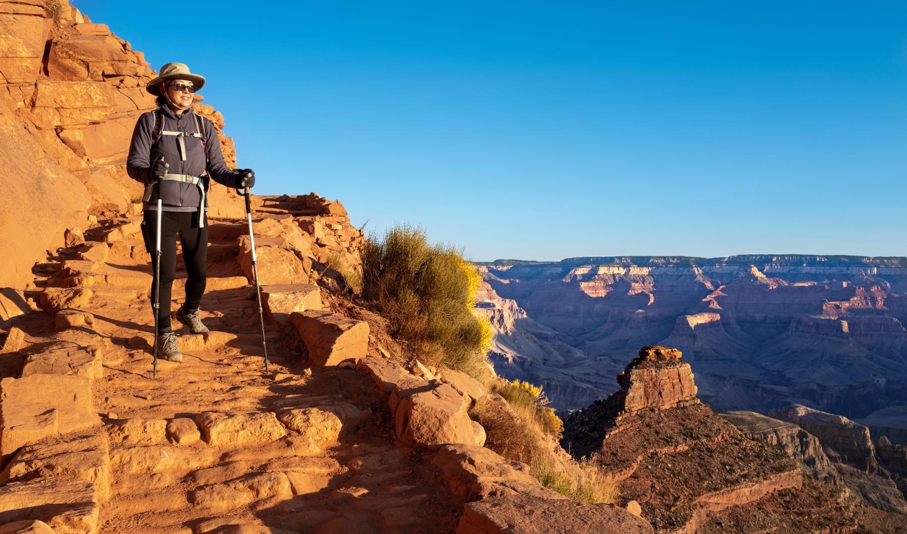 Find your perfect fit at Overture Kierland a man standing on a mountain with the sky behind him