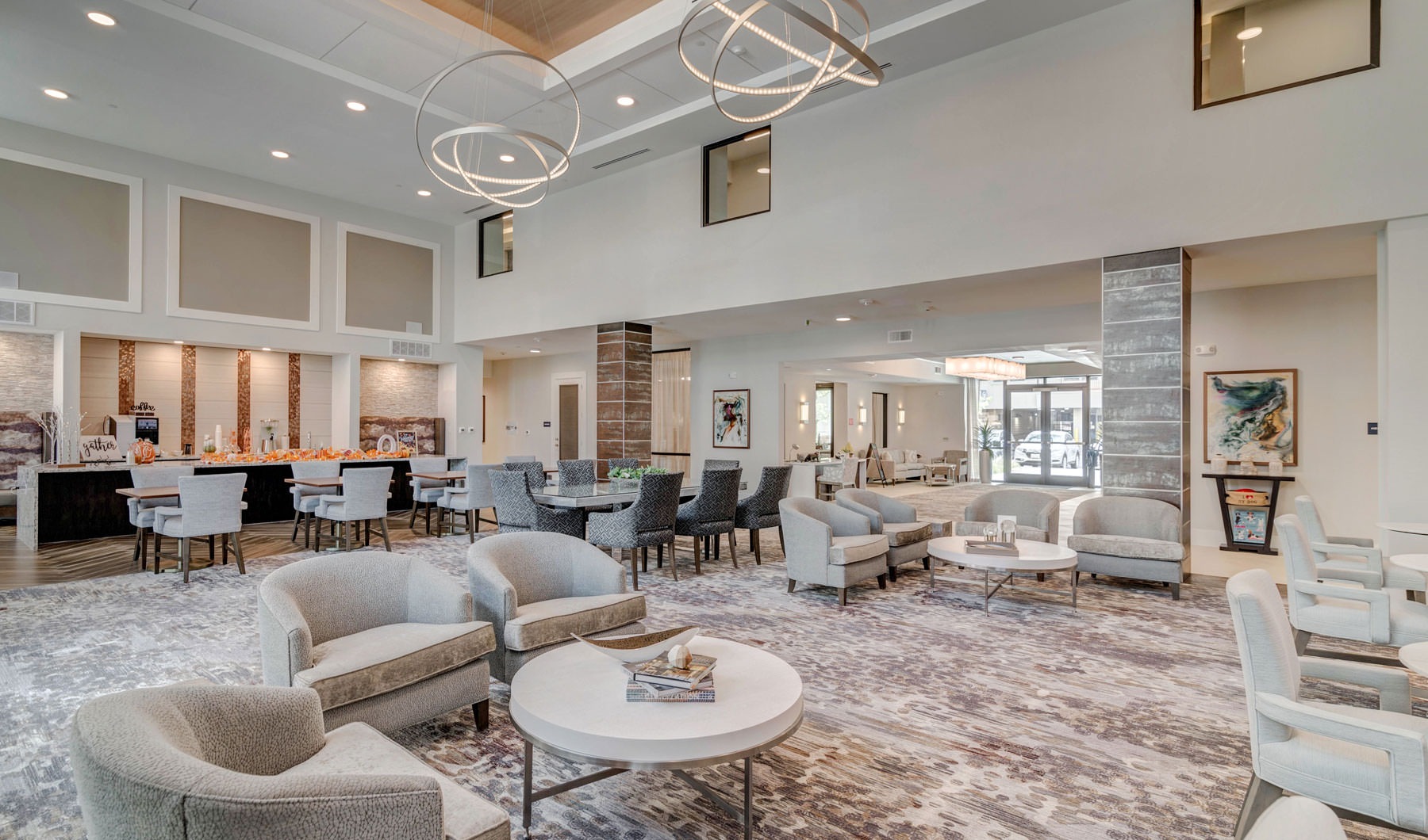 Take advantage of all Overture Arboretum has to offer a large room with a chandelier and chairs