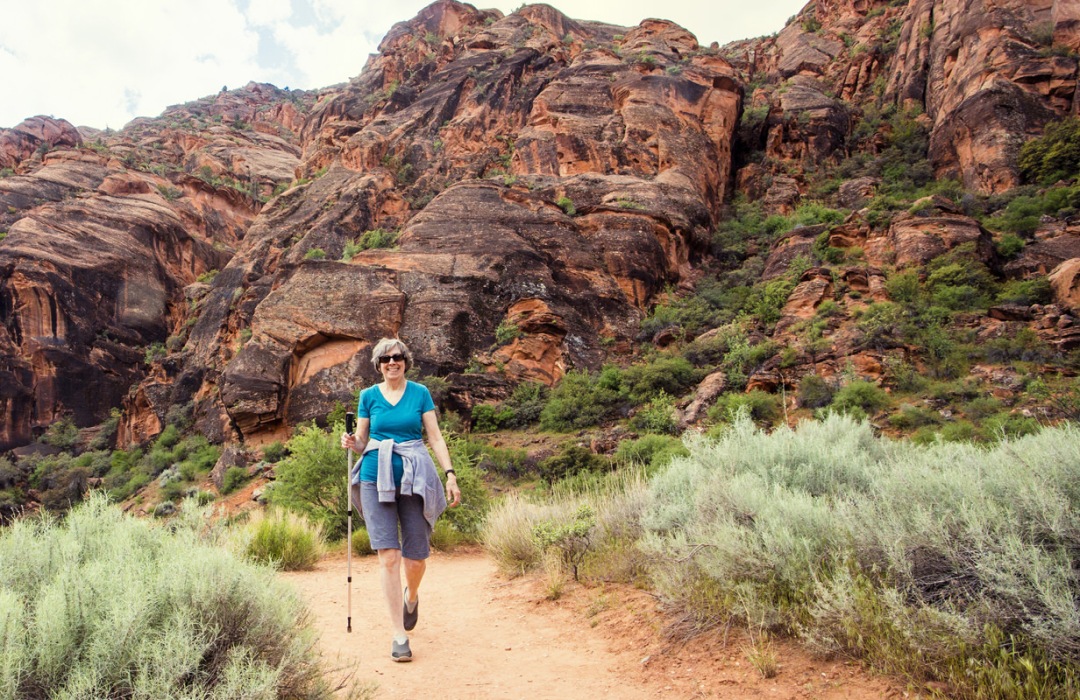 Senior woman hiking along a trail in Arizona