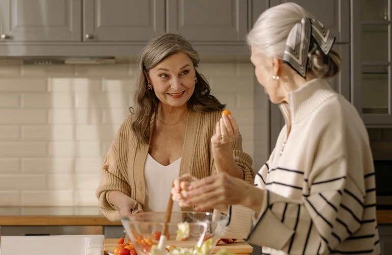 women cook in a kitchen
