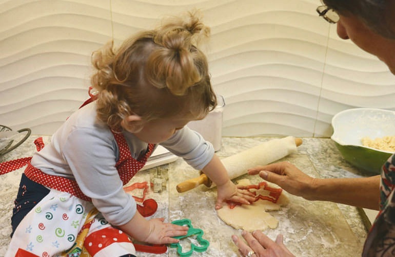 toddler playing with dough