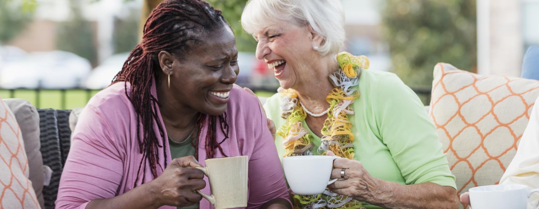 Friends sitting outside enjoying coffee