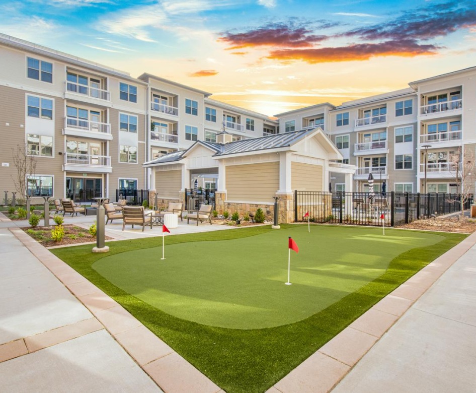 View of the property and putting green