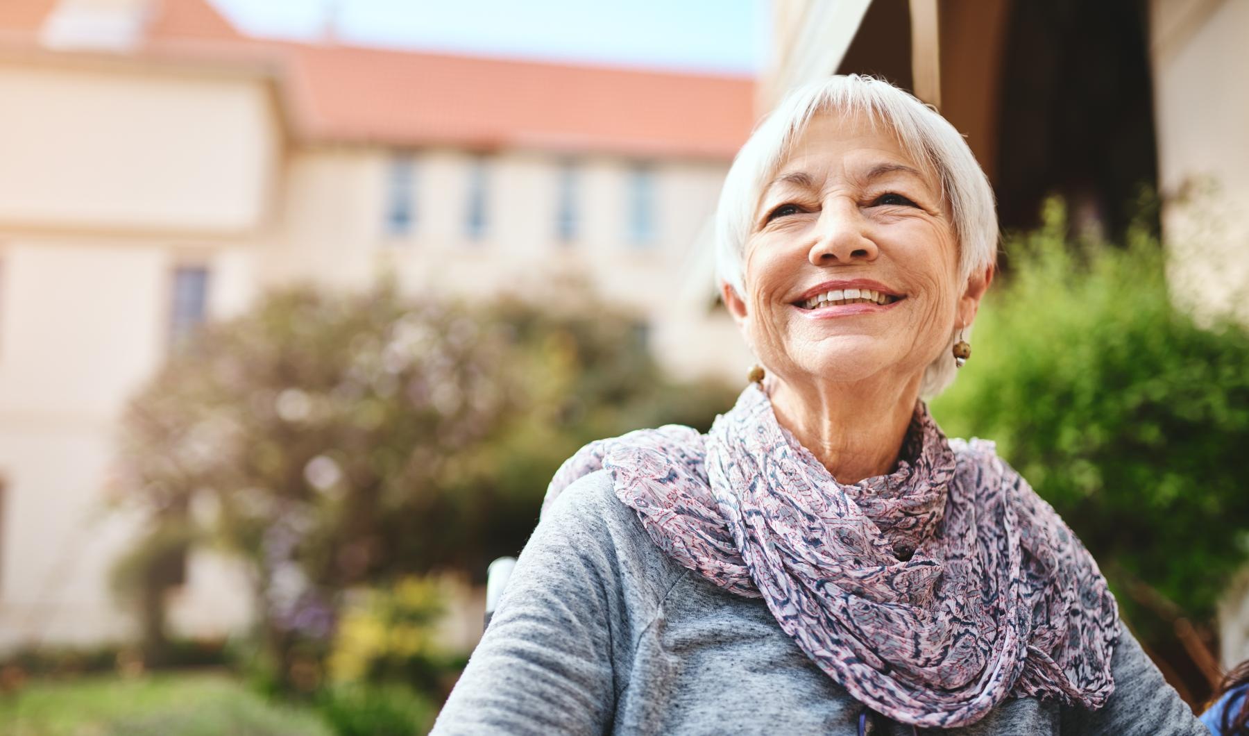 Settle into comfort at Overture San Marcos a woman smiling outside