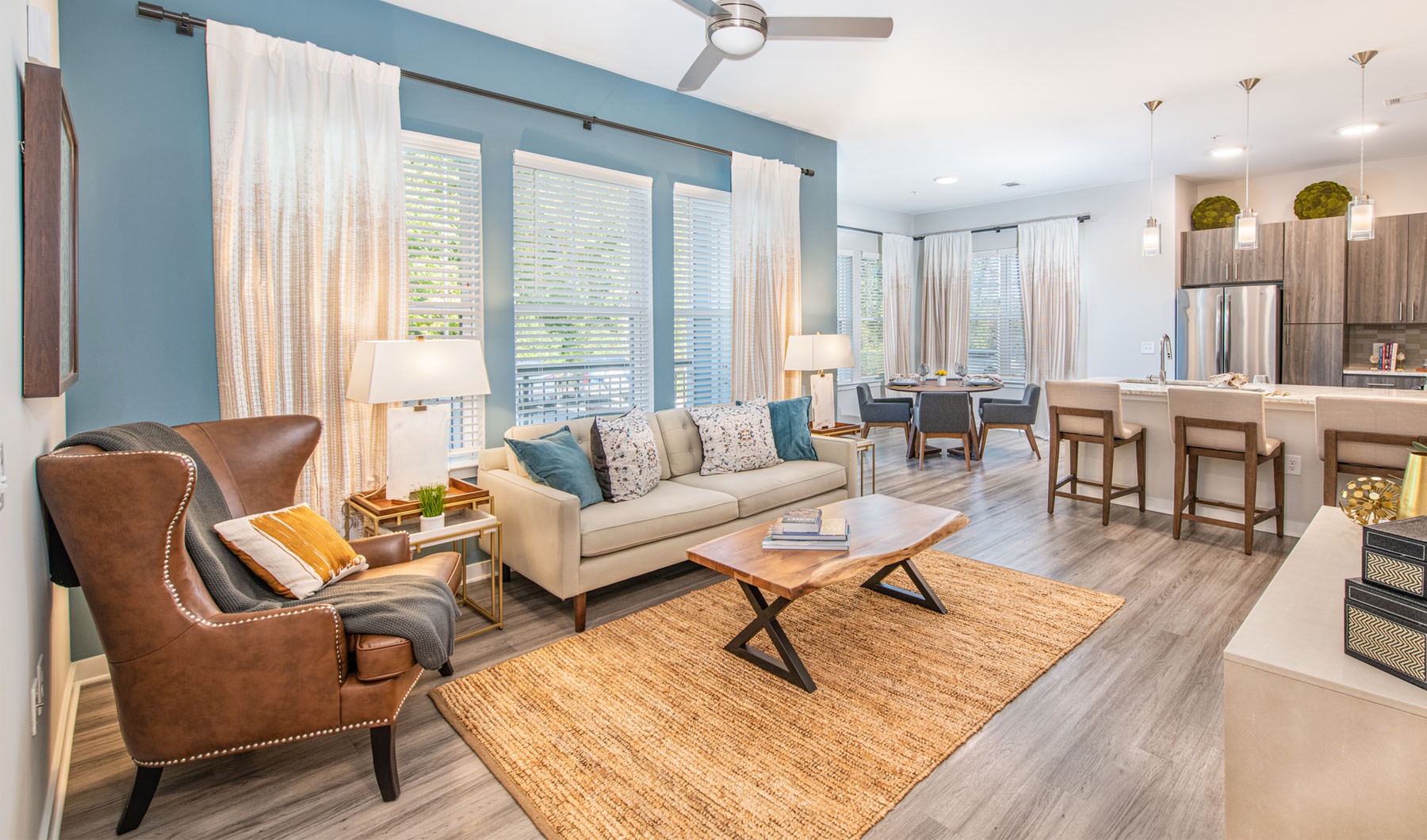 Wide open living areas flooded with natural light a living room with a large window