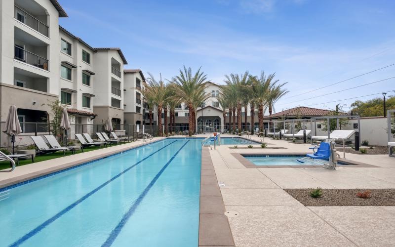 swimming pool and jacuzzi with chair lift