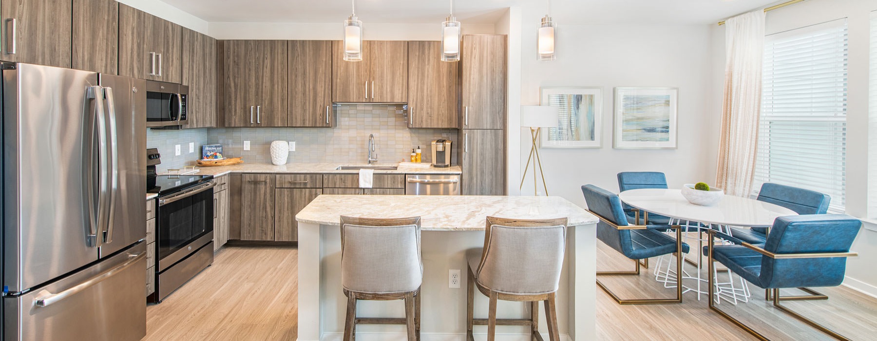 a kitchen with a dining table and chairs