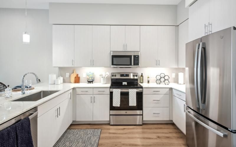 a kitchen with under cabinet lighting