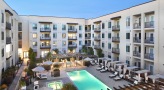 a courtyard with a pool in the middle