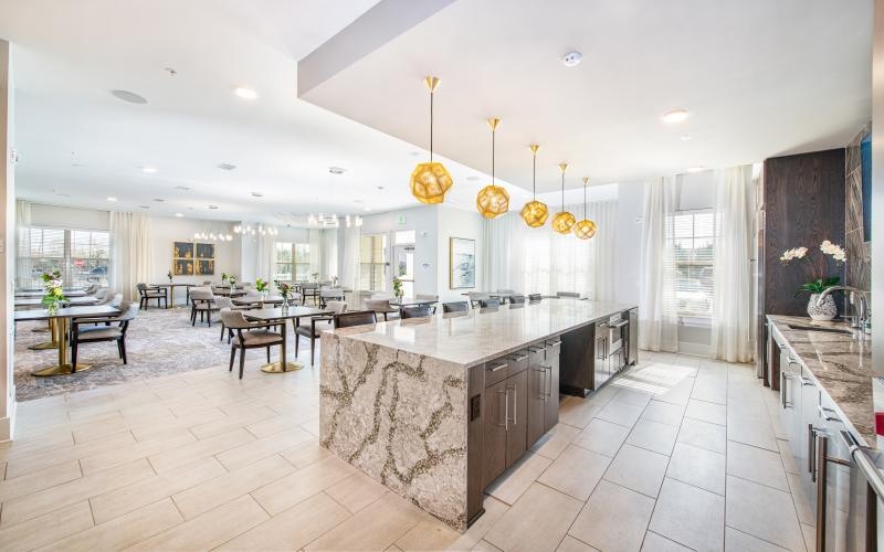 Demonstration kitchen with large bar and multiple tables