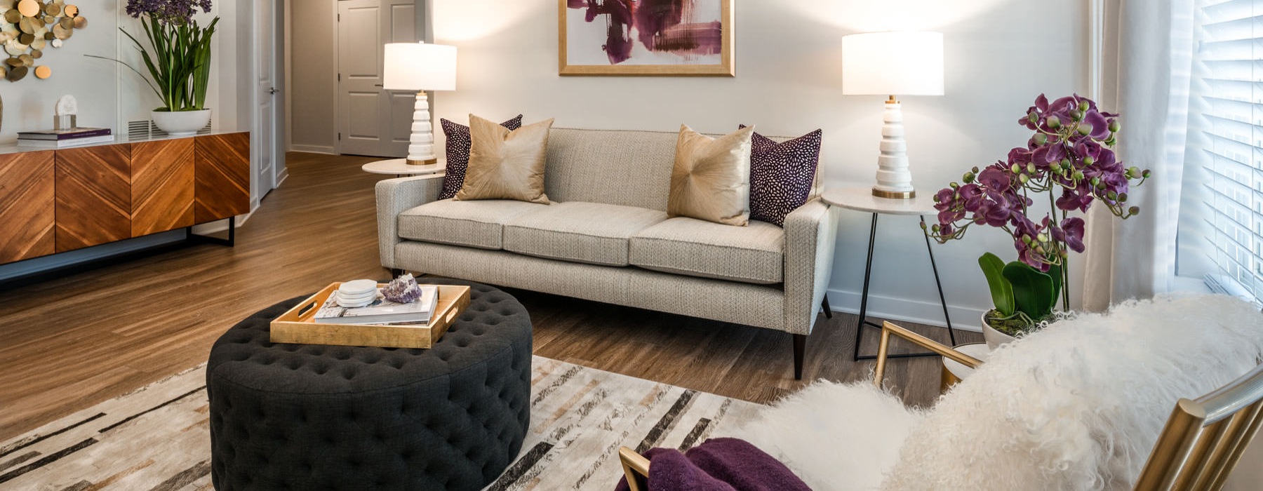 Spacious living room with lots of natural light and cozy finishes