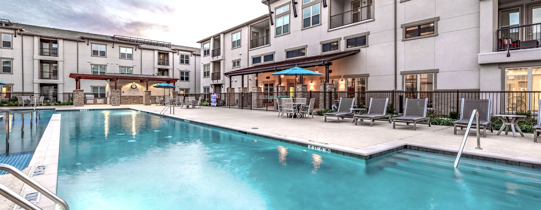 apartments overlooking outdoor swimming pool 