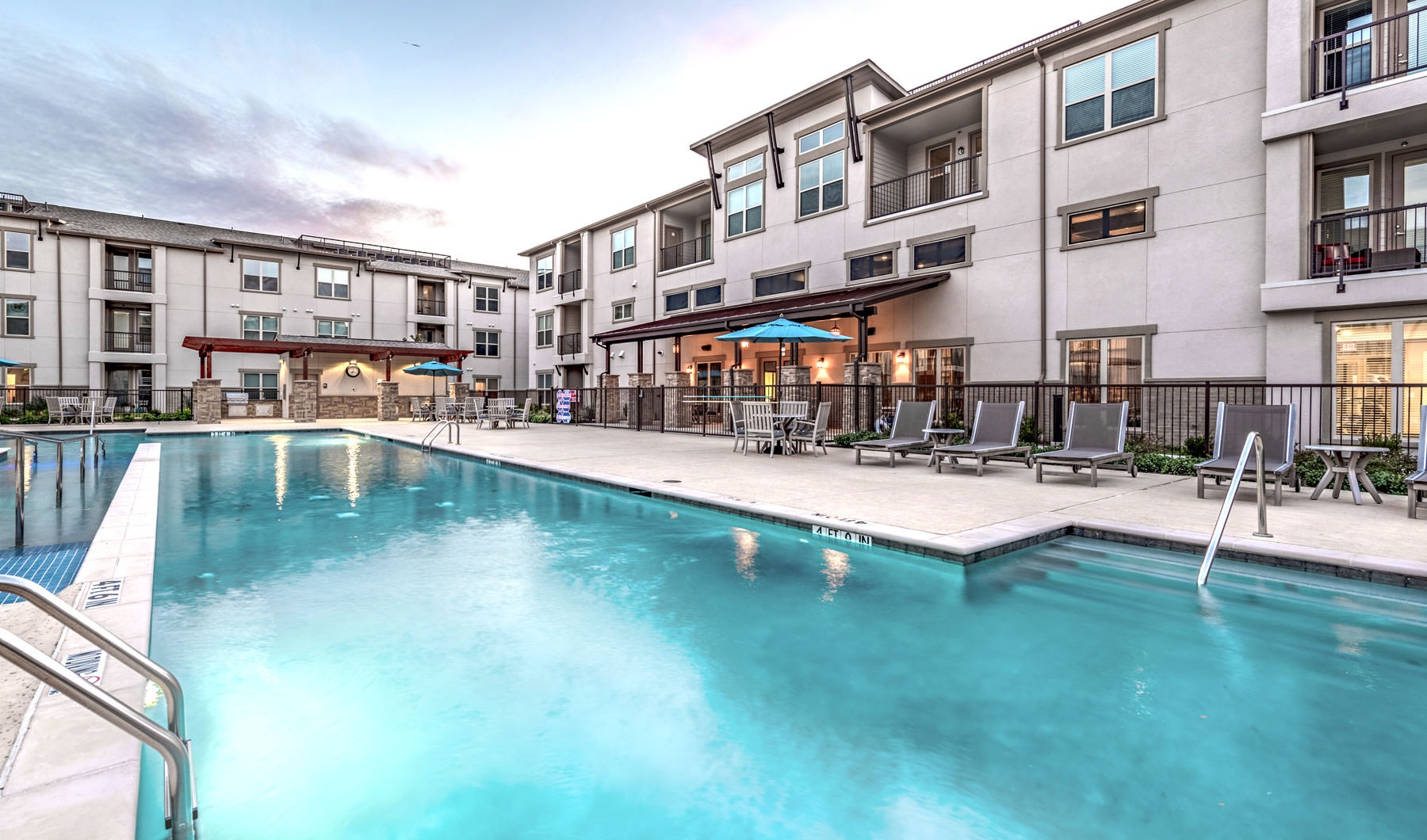 apartments overlooking outdoor swimming pool 