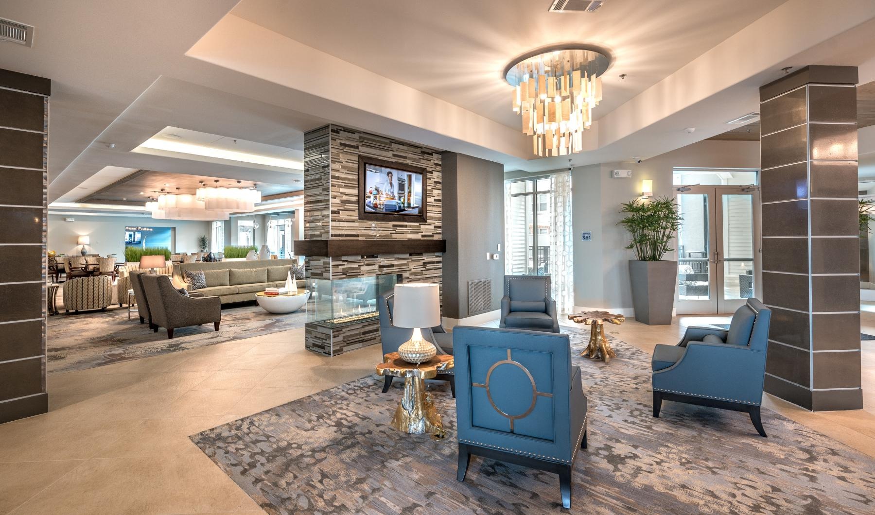 lobby with chairs and a fireplace