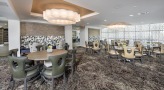 resident dining room with recessed lighting throughout