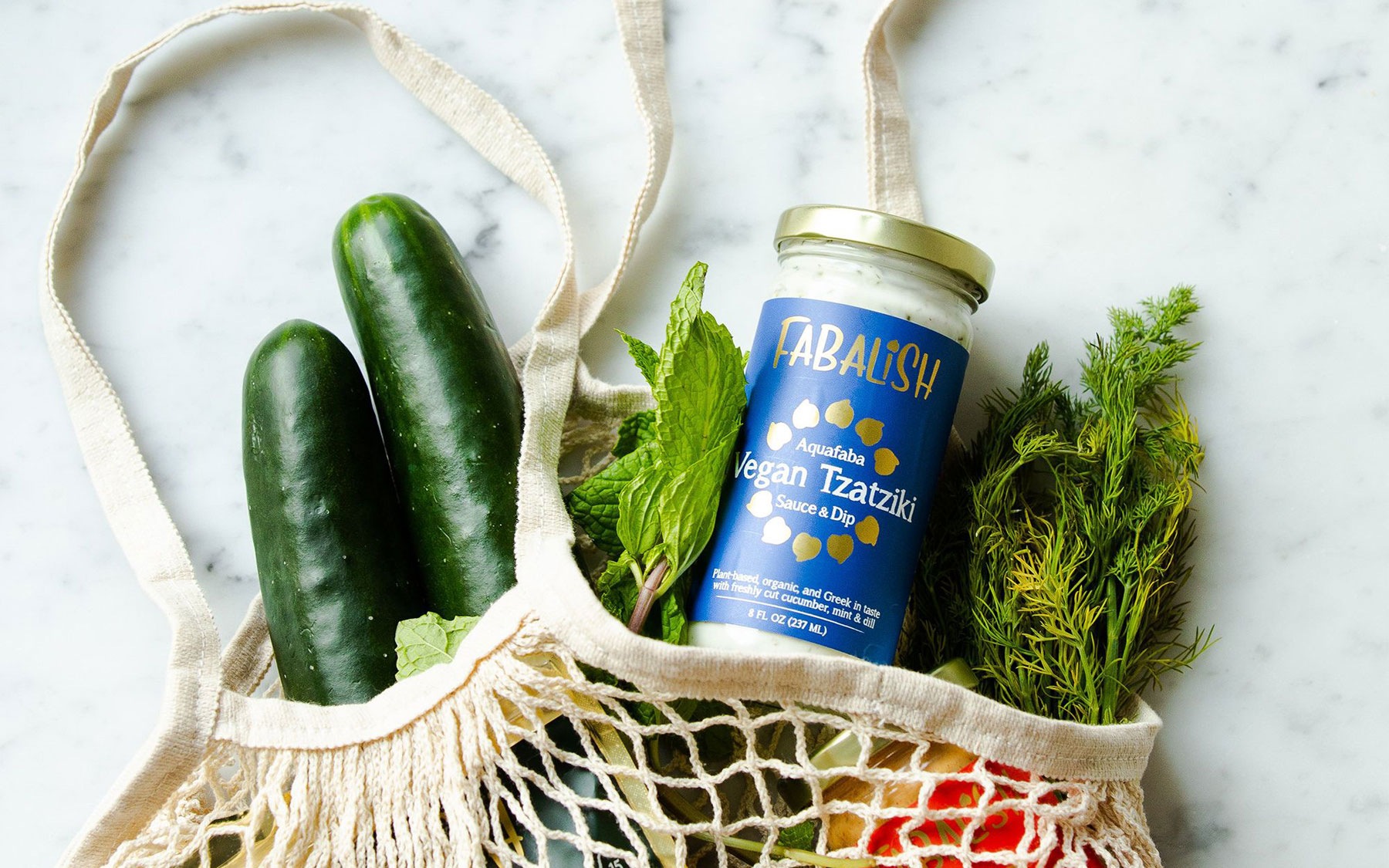 Bag of groceries laying on a granite countertop