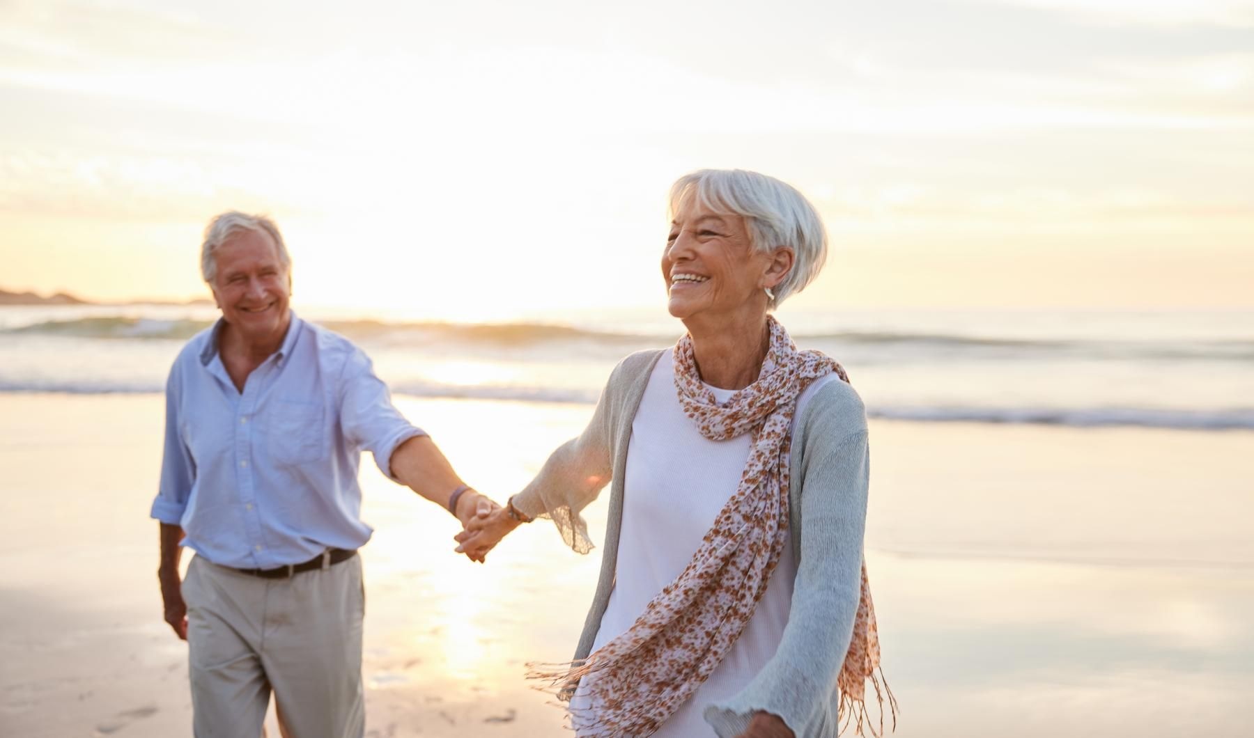 Beach Couple walking and holding hands on the beach