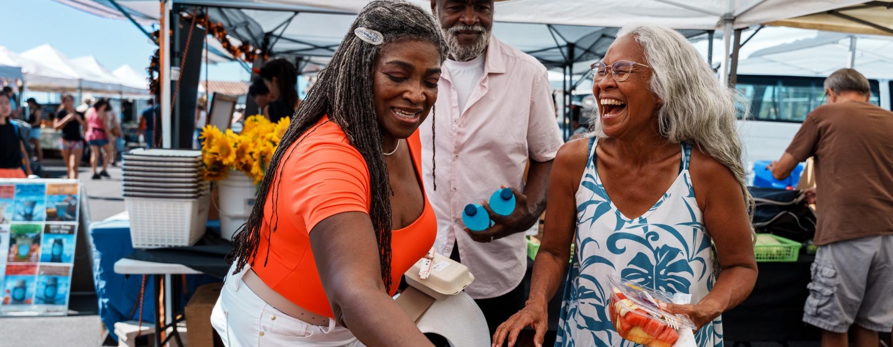 Friends shopping at a local farmers market