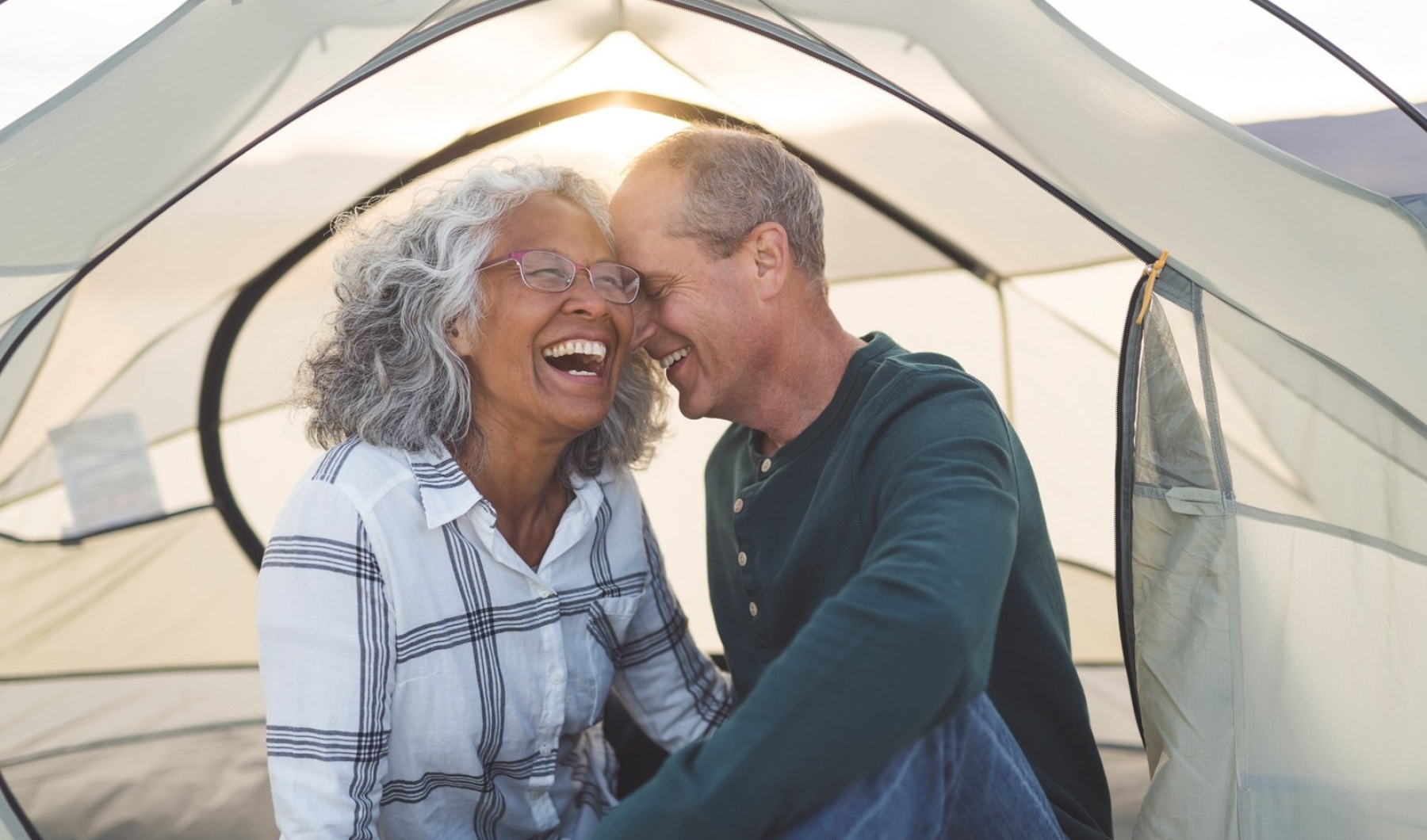 Lifestyle Couple sitting in a tent