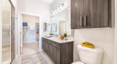 Large bathroom with double vanity sinks and a large mirror