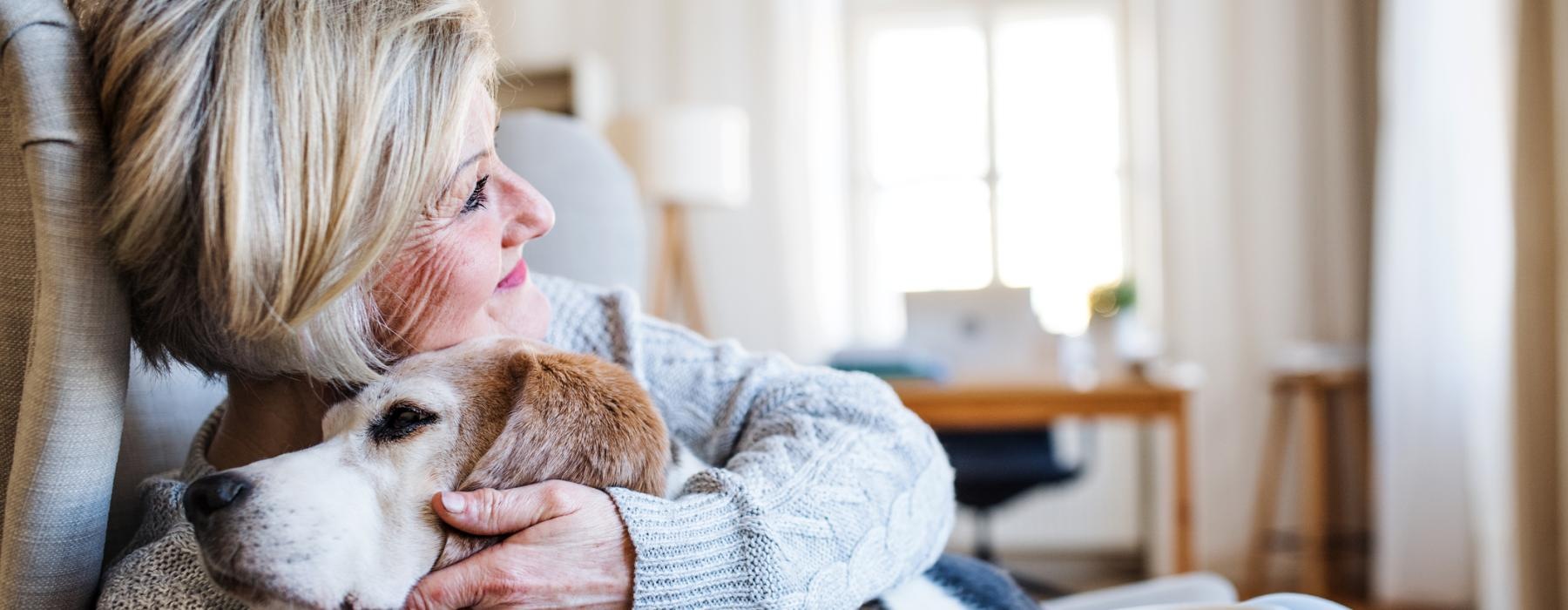 a woman hugging a dog