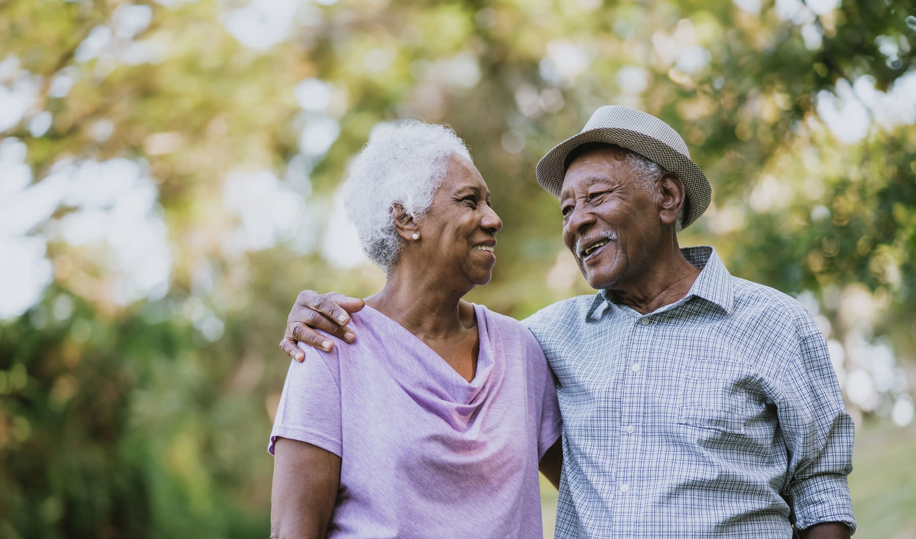 Your Joy to Embrace a man and woman walking outside and smiling