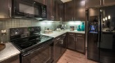 kitchen with dark cabinets