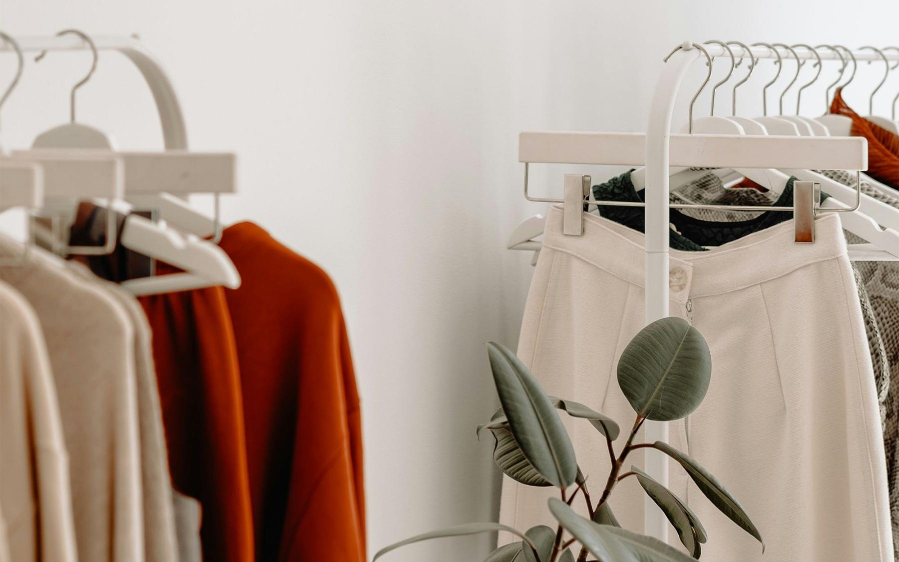 Clothing Store Clothes hanging on a rack inside of a store